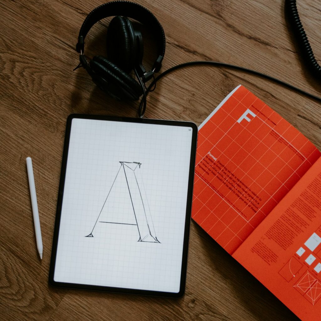 Sticker and logo design on a tablet